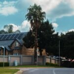 Large residential house with rooftop solar panels illustrating home solar installation costs