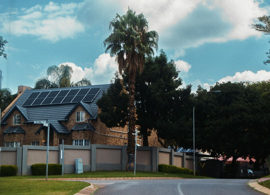 Large residential house with rooftop solar panels illustrating home solar installation costs
