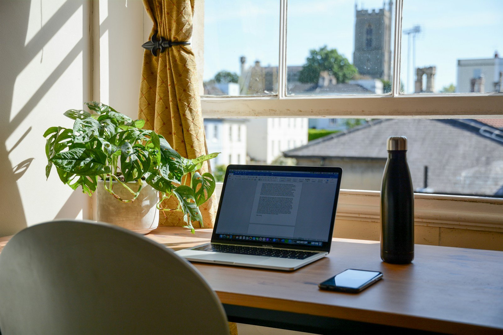 Home-office workspace illustrating a measured electronics backup-load plan
