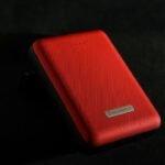 Portable power bank showing input and output ports for pass-through charging checks