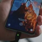 Smartphone charging with a cable as an illustration of power bank recharge time