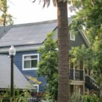 Residential house roof fitted with solar panels