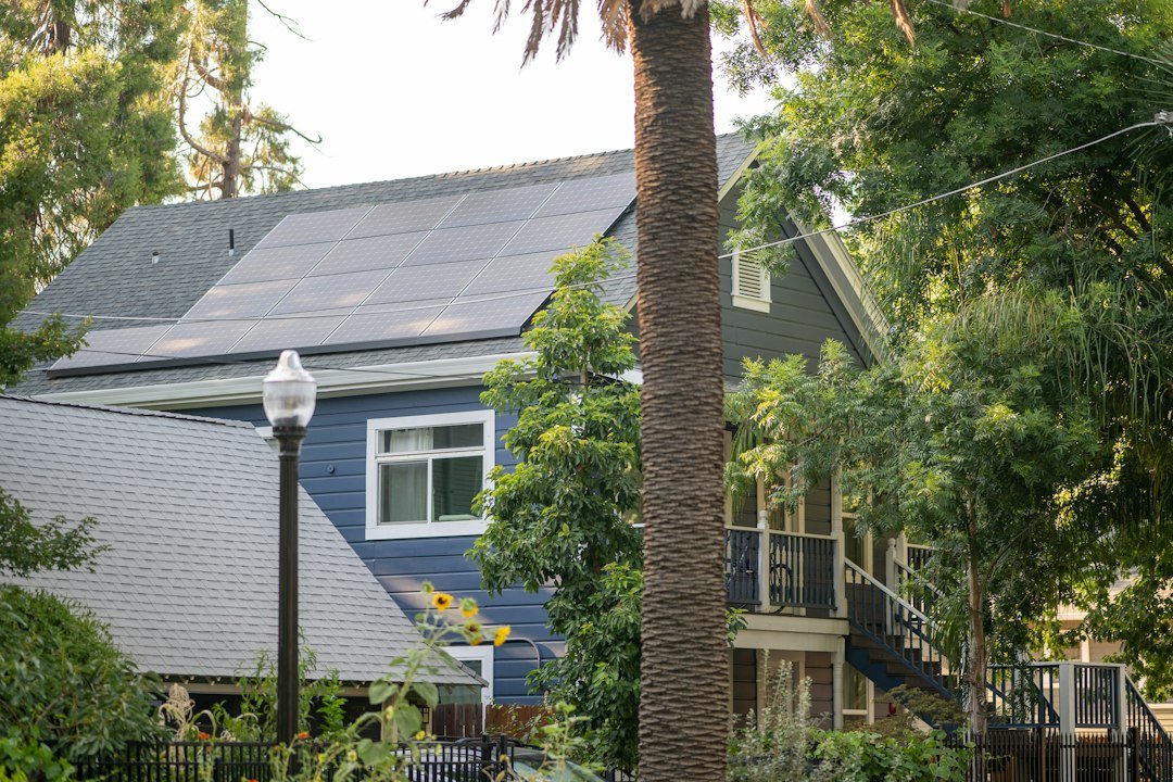 Residential house roof fitted with solar panels