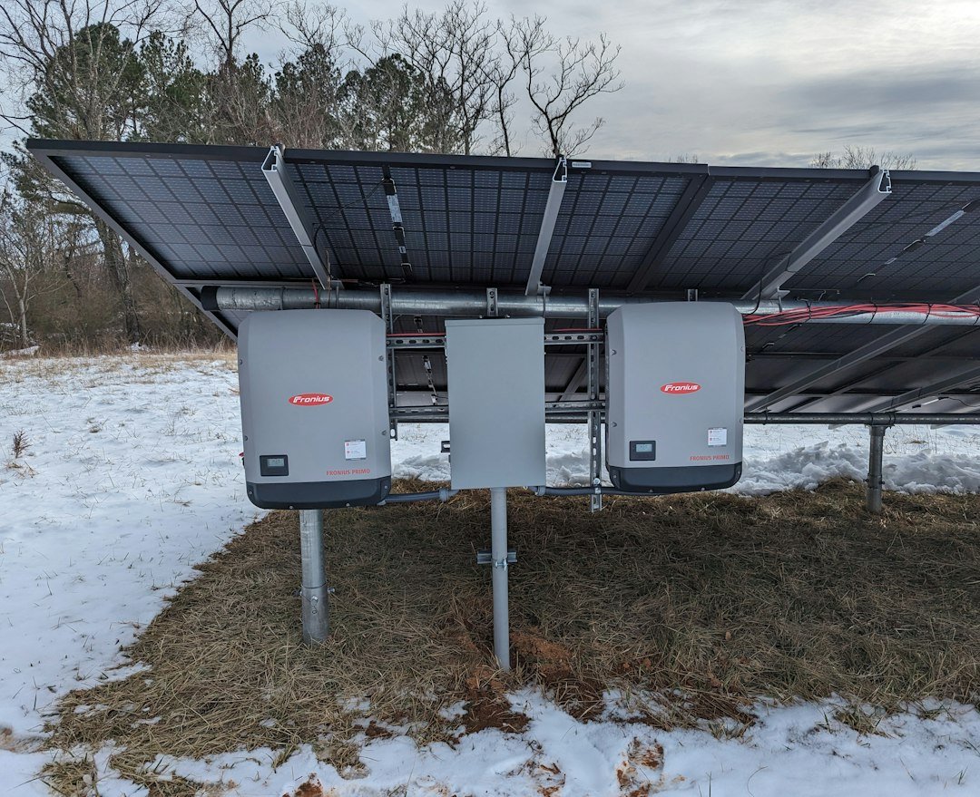 Solar power system with photovoltaic panels and inverters, illustrating equipment used alongside home battery storage