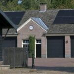 Modern building with rooftop solar panels illustrating residential photovoltaic electricity efficiency