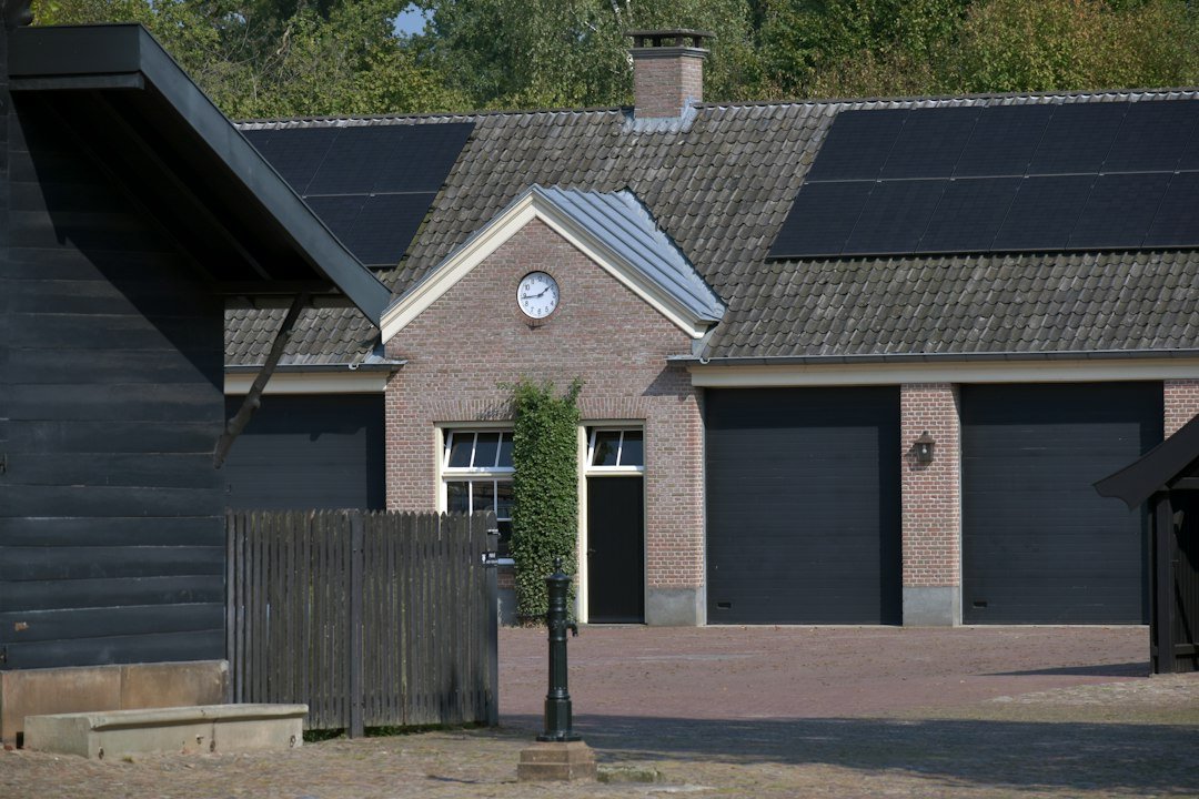Modern building with rooftop solar panels illustrating residential photovoltaic electricity efficiency