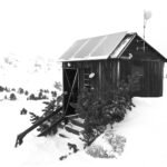 Wooden cabin with solar panels illustrating off-grid energy planning