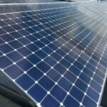 Several framed photovoltaic panels arranged in rows