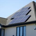 Solar panels on a house roof illustrating household energy planning