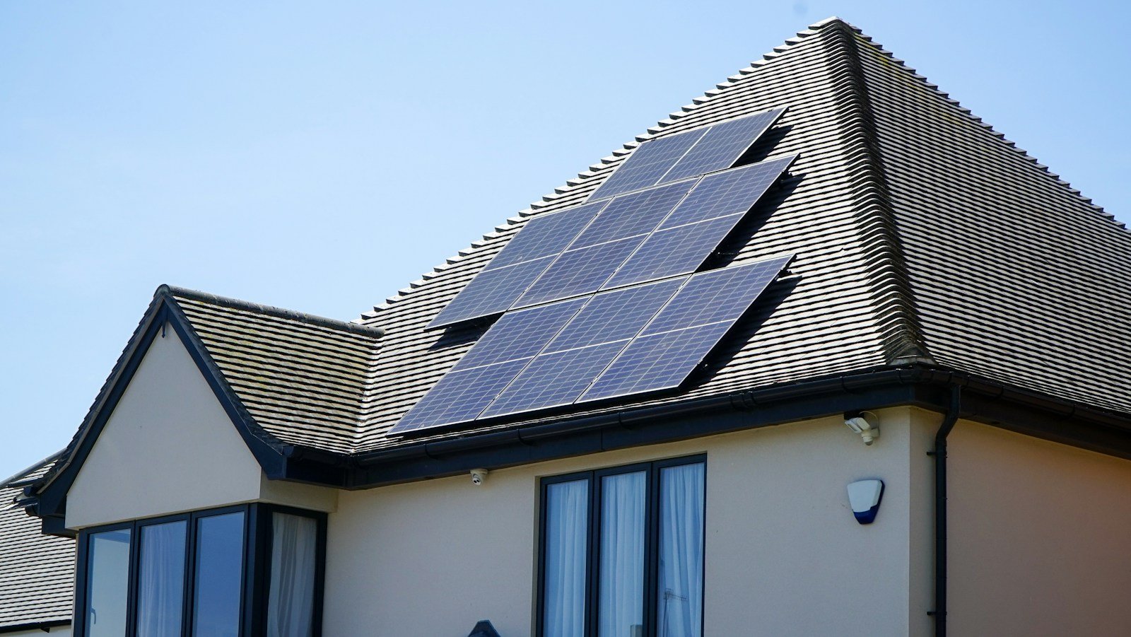 Solar panels on a house roof illustrating household energy planning