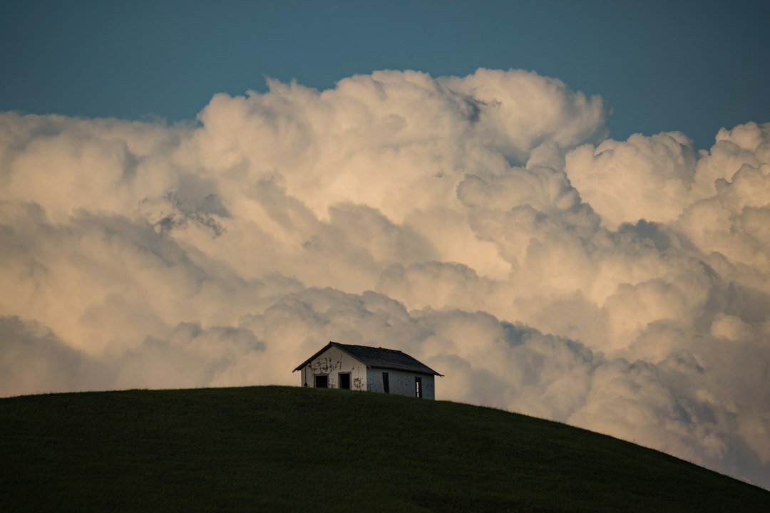 I loved the way the storm clouds were bellowing up behind this little house.